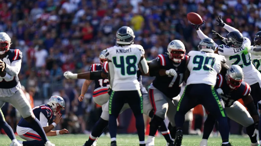 Sep 15, 2024; Foxborough, Massachusetts, USA; Seattle Seahawks safety Julian Love (20) blocks the field goal attempt by New England Patriots place kicker Joey Slye (13) in the fourth quarter at Gillette Stadium. Mandatory Credit: David Butler II-Imagn Images