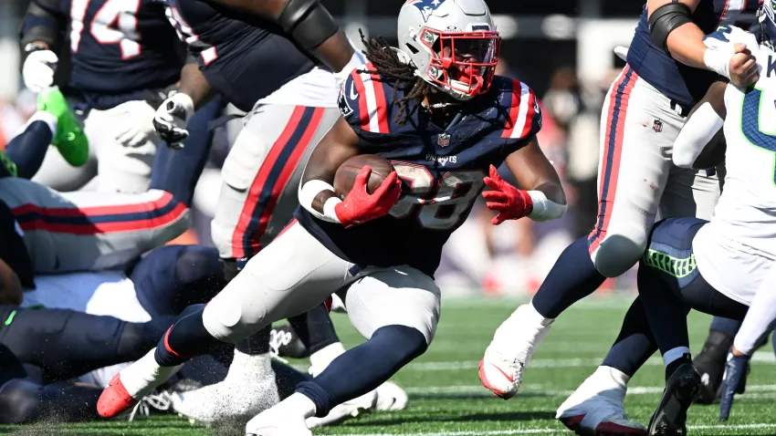 Sep 15, 2024; Foxborough, Massachusetts, USA;  New England Patriots running back Rhamondre Stevenson (38) runs with the ball against the Seattle Seahawks during the second half at Gillette Stadium. Mandatory Credit: Brian Fluharty-Imagn Images