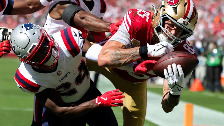 Sep 29, 2024; Santa Clara, California, USA; San Francisco 49ers tight end George Kittle (85) catches a touchdown against New England Patriots safety Dell Pettus (24) during the second quarter at Levi’s Stadium. Mandatory Credit: Sergio Estrada-Imagn Images