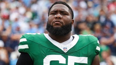 Jets OL Xavier Newman-Johnson carted off with apparent neck injury