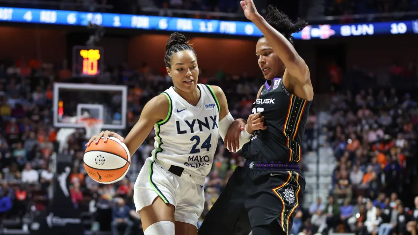 Oct 4, 2024; Uncasville, Connecticut, USA; Minnesota Lynx forward Napheesa Collier (24) drives to the basket defended by Connecticut Sun forward Alyssa Thomas (25) during the first half during game three of the 2024 WNBA Semi-finals at Mohegan Sun Arena. Mandatory Credit: Paul Rutherford-Imagn Images