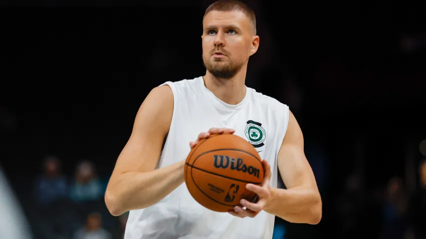 Nov 2, 2024; Charlotte, North Carolina, USA; Boston Celtics center Kristaps Porzingis shoots before a game against the Charlotte Hornets at Spectrum Center. Porzingis is on injured reserve. Mandatory Credit: Nell Redmond-Imagn Images