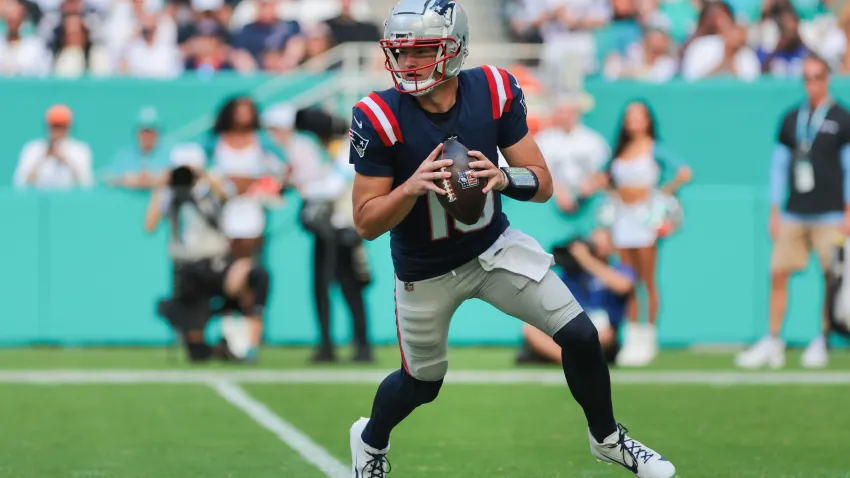 Nov 24, 2024; Miami Gardens, Florida, USA; New England Patriots quarterback Drake Maye (10) drops back against the Miami Dolphins during the first quarter at Hard Rock Stadium. Mandatory Credit: Sam Navarro-Imagn Images