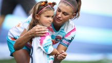 SAN DIEGO, CALIFORNIA - SEPTEMBER 08: Alex Morgan #13 of San Diego Wave FC interacts with her daughter, Charlie, before the game against North Carolina Courage at Snapdragon Stadium on September 08, 2024 in San Diego, California. (Photo by Meg Oliphant/Getty Images)