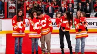 The Gaudreau family are honoured before the game between the Calgary Flames and the Columbus Blue Jackets at Scotiabank Saddledome on December 3, 2024 in Calgary, Alberta, Canada.