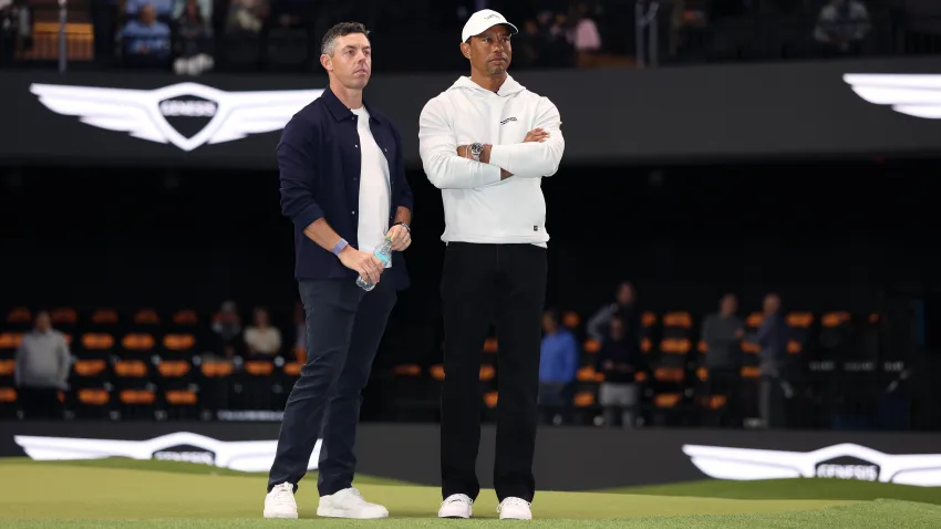 Rory McIlroy and Tiger Woods look on