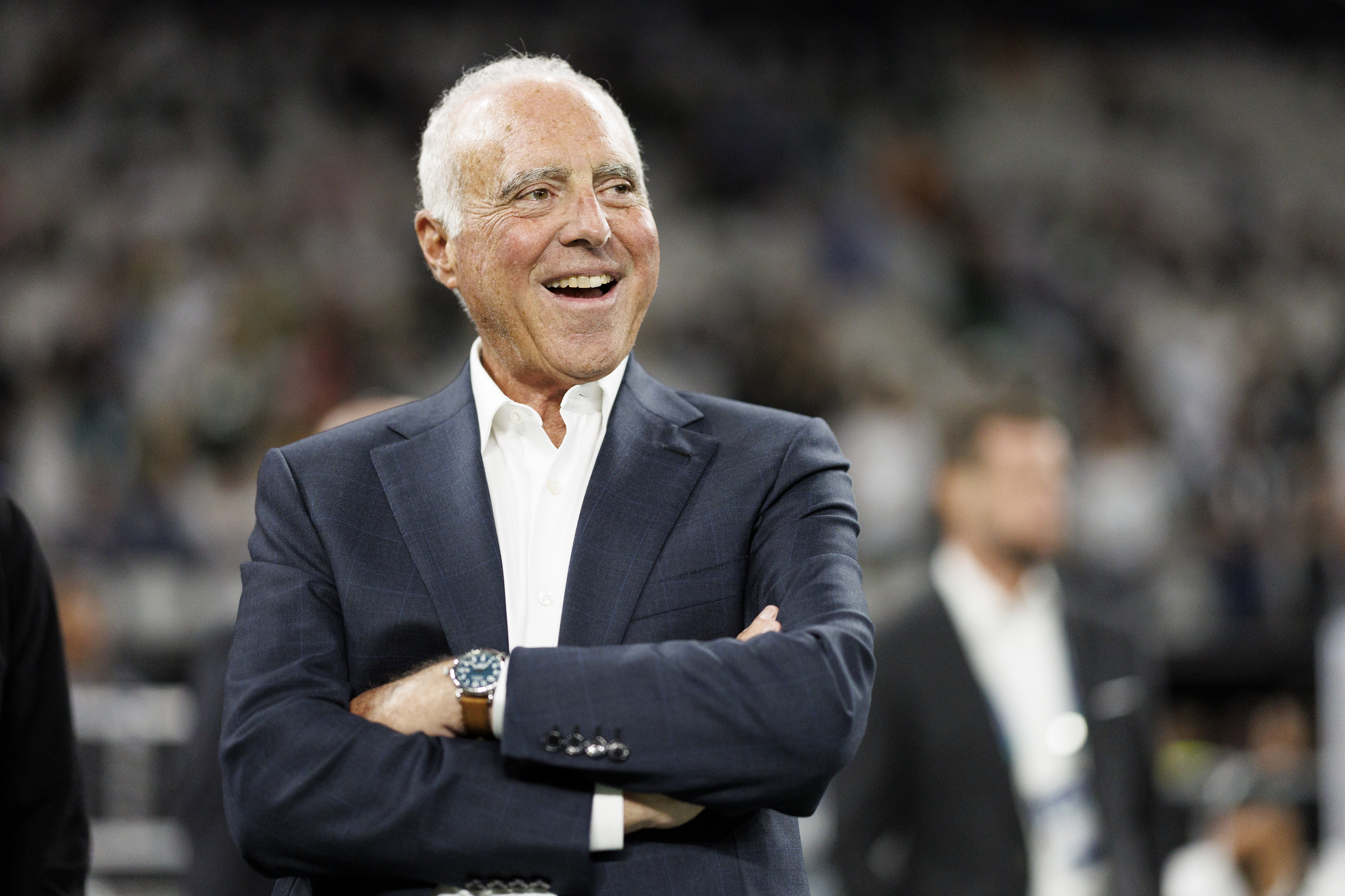 Eagles owner Jeffrey Lurie stands on the field