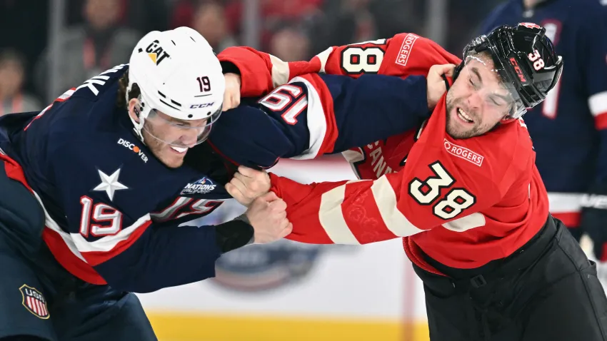 Matthew Tkachuk #19 of Team USA fights with Brandon Hagel #38 of Team Canada