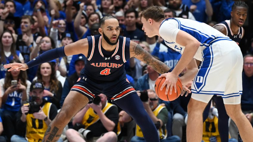 Cooper Flagg controls the ball in front of Johni Broome