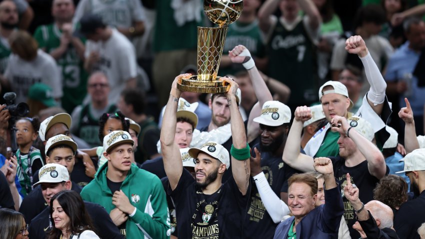 BOSTON, MASSACHUSETTS – JUNE 17: Jayson Tatum #0 of the Boston Celtics lifts the Larry O’Brien Championship Trophy after Boston’s 106-88 win against the Dallas Mavericks in Game Five of the 2024 NBA Finals at TD Garden on June 17, 2024 in Boston, Massachusetts. NOTE TO USER: User expressly acknowledges and agrees that, by downloading and or using this photograph, User is consenting to the terms and conditions of the Getty Images License Agreement. (Photo by Adam Glanzman/Getty Images)