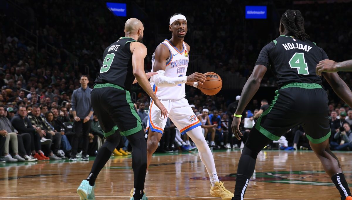 Shai Gilgeous-Alexander of the Oklahoma City Thunder driving to the basket in NBA action, chasing Wilt Chamberlain consecutive 20-point game record