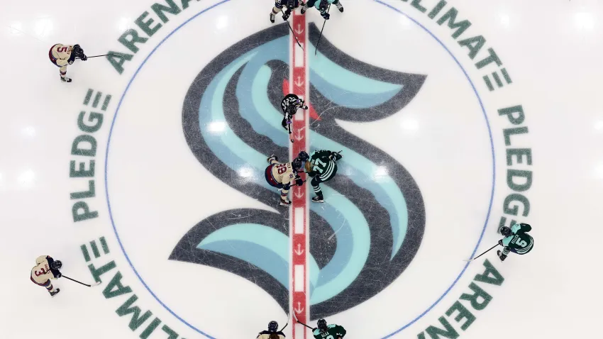 Marie-Philip Poulin takes a faceoff against Susanna Tapani in Seattle