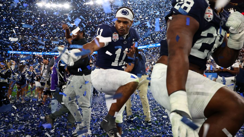 Dec 31, 2024; Glendale, AZ, USA; Penn State Nittany Lions defensive end Abdul Carter (11) reacts with teammates after defeating the Boise State Broncos in the Fiesta Bowl at State Farm Stadium. Mandatory Credit: Mark J. Rebilas-Imagn Images