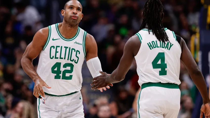 Jan 7, 2025; Denver, Colorado, USA; Boston Celtics center Al Horford (42) and guard Jrue Holiday (4) in the first quarter against the Denver Nuggets at Ball Arena. Mandatory Credit: Isaiah J. Downing-Imagn Images