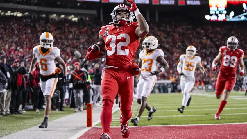Ohio State Buckeyes running back TreVeyon Henderson (32) runs for a touchdown during the first half of the College Football Playoff first round game against the Tennessee Volunteers at Ohio Stadium in Columbus on Dec. 21, 2024.
