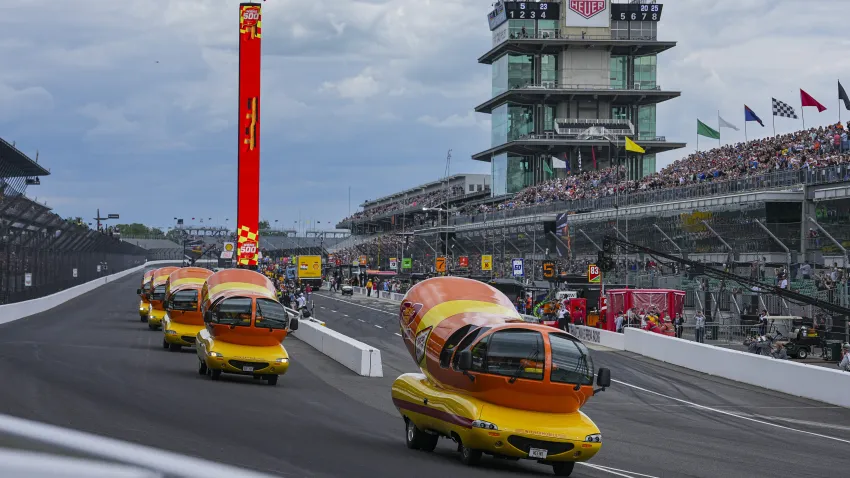The Oscar Mayer Wienermobiles head into the first turn as they compete in the Wienie 500 following the practice session for the Indianapolis 500 auto race at Indianapolis Motor Speedway in Indianapolis, Friday, May 23, 2025.