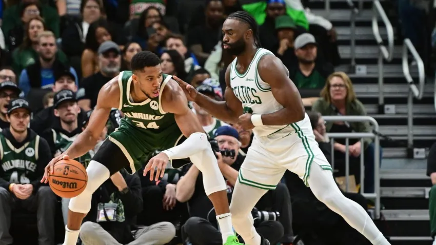 Nov 10, 2024; Milwaukee, Wisconsin, USA; Milwaukee Bucks forward Giannis Antetokounmpo (34) is guarded by Boston Celtics forward Jaylen Brown (7) in the fourth quarter at Fiserv Forum. Mandatory Credit: Benny Sieu-Imagn Images