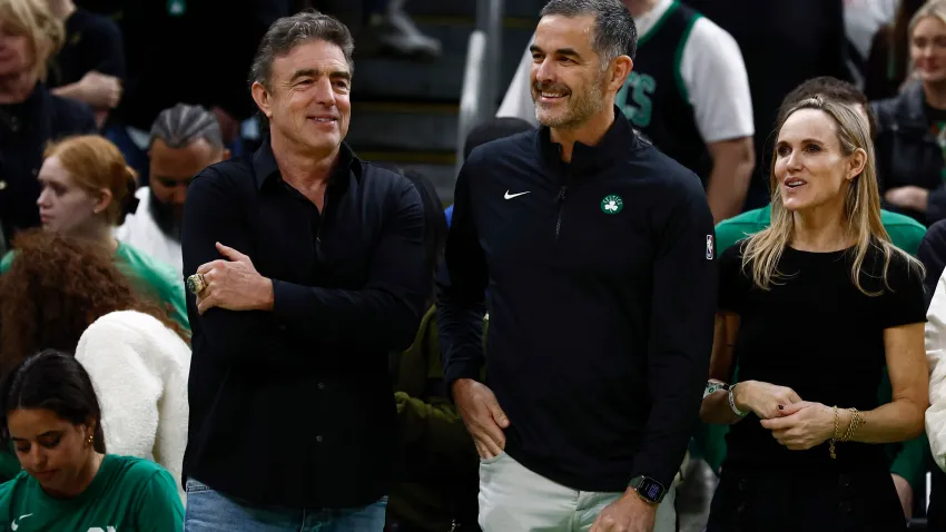 Apr 4, 2025; Boston, Massachusetts, USA; Bill Chisholm, center, who leads a group that is buying the Boston Celtics, stands with current owner Wyc Grousbeck and Chisholm’s wife, Kimberly Chisholm before the game between the Boston Celtics and the Phoenix Suns at TD Garden. Mandatory Credit: Winslow Townson-Imagn Images
