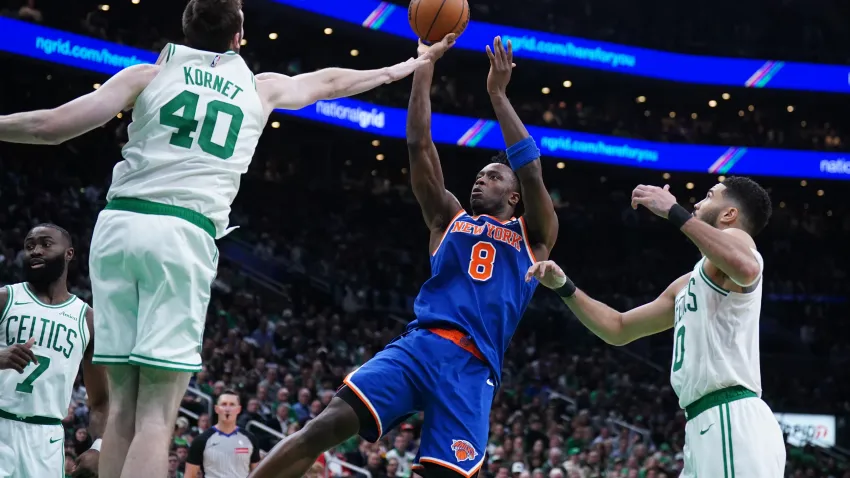 May 5, 2025; Boston, Massachusetts, USA; New York Knicks forward OG Anunoby (8) shoots the ball against Boston Celtics center Luke Kornet (40) in the second quarter during game one of the second round for the 2025 NBA Playoffs at TD Garden. Mandatory Credit: David Butler II-Imagn Images