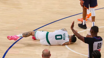 Jayson Tatum carried off court with lower leg injury