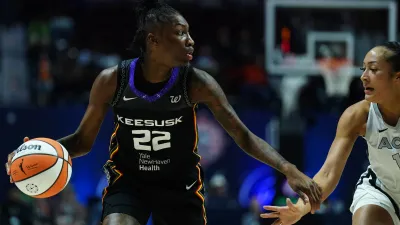 May 20, 2025; Uncasville, Connecticut, USA; Connecticut Sun guard Saniya Rivers (22) looks for an opening against Las Vegas Aces guard Aaliyah Nye (13) in the second half at Mohegan Sun Arena. Mandatory Credit: David Butler II-Imagn Images
