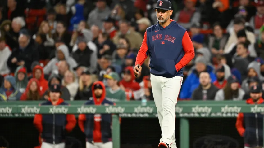 May 21, 2025; Boston, Massachusetts, USA; Boston Red Sox manager Alex Cora (13) walks to the mound during the sixth inning against the New York Mets at Fenway Park. Mandatory Credit: Eric Canha-Imagn Images