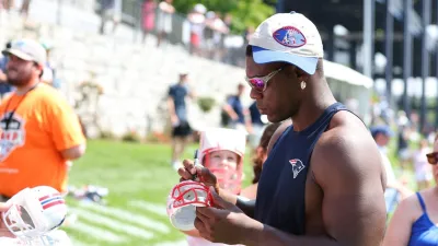 FOXBOROUGH, MA – JULY 25: New England Patriots defensive end Keion White (99) signs autographs following New England Patriots Training Camp on July 25, 2025, at Gillette Stadium in Foxborough, MA. (Photo by M. Anthony Nesmith/Icon Sportswire via Getty Images)