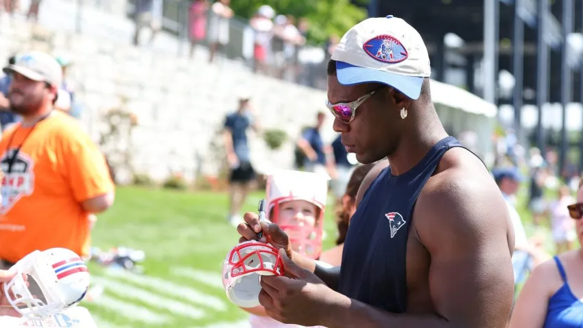 FOXBOROUGH, MA – JULY 25: New England Patriots defensive end Keion White (99) signs autographs following New England Patriots Training Camp on July 25, 2025, at Gillette Stadium in Foxborough, MA. (Photo by M. Anthony Nesmith/Icon Sportswire via Getty Images)