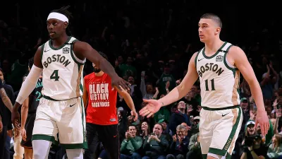 Jrue Holiday (4) and Payton Pritchard (11)