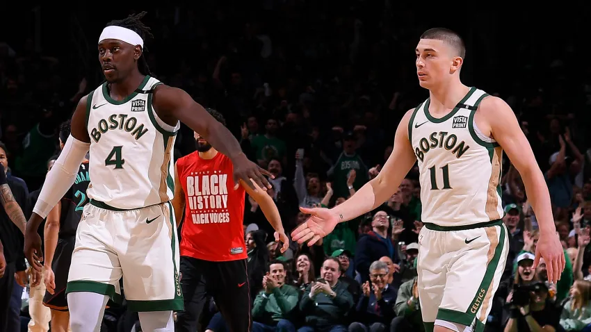 Jrue Holiday (4) and Payton Pritchard (11)