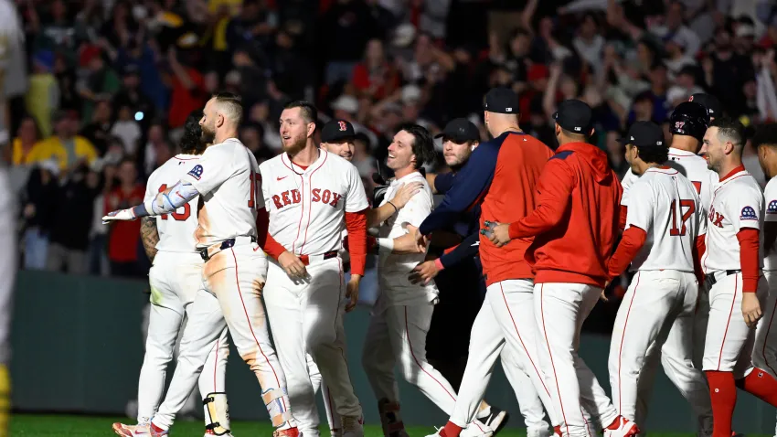 Sep 17, 2025; Boston, Massachusetts, USA; Boston Red Sox first baseman Nick Sogard (20) (center) celebrates his walk-off RBI during the tenth inning against the Athletics at Fenway Park. Mandatory Credit: Eric Canha-Imagn Images