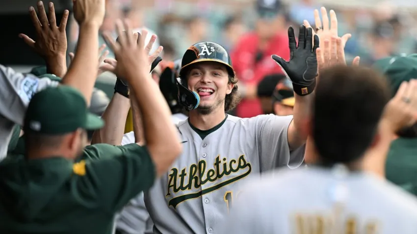 Jun 25, 2025; Detroit, Michigan, USA; Athletics first baseman Nick Kurtz (16) celebrates in the dugout after hitting a three-run home run against the Detroit Tigers in the third inning at Comerica Park. Mandatory Credit: Lon Horwedel-Imagn Images