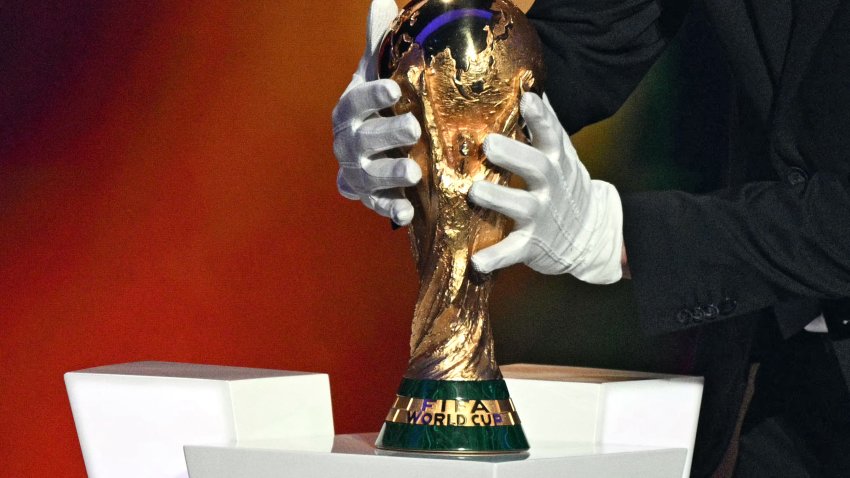 Argentina’s head coach Lionel Scaloni places on a pedestal the World Cup Trophy during the draw for the 2026 FIFA Football World Cup taking place in the US, Canada and Mexico, at the Kennedy Center, in Washington, DC, on December 5, 2025. (Photo by Jim WATSON / AFP via Getty Images)