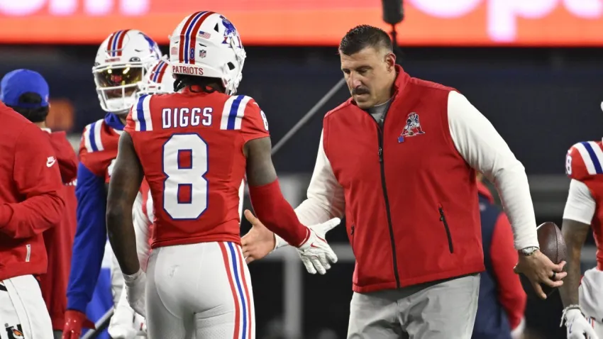 Dec 1, 2025; Foxborough, Massachusetts, USA; New England Patriots wide receiver Stefon Diggs (8) and New England Patriots head coach Mike Vrabel high-five prior to the game against the New York Giants at Gillette Stadium. Mandatory Credit: Eric Canha-Imagn Images